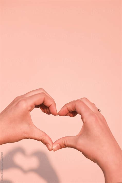 "Hands Making A Heart Sign." by Stocksy Contributor "Sky-Blue Creative" - Stocksy