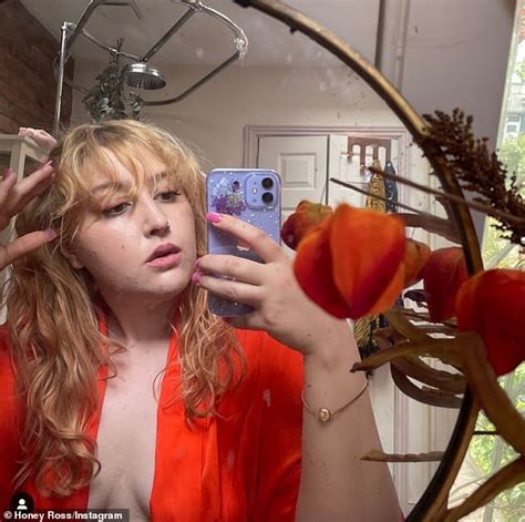 Honey Ross sets pulses racing as she poses in a plunging orange robe for body positive snap ...