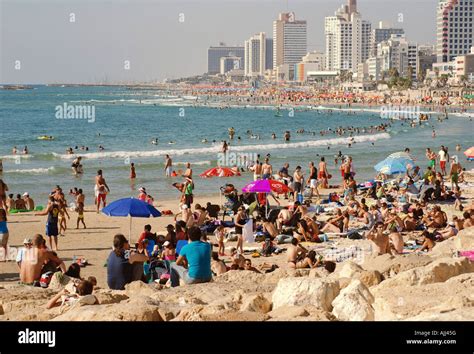 Israel Tel Aviv A crowd of people relaxing and cooling off on the Tel ...