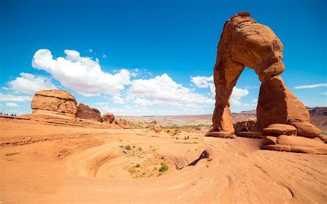 desert rock formation landscape arches national park arch utah clouds ...