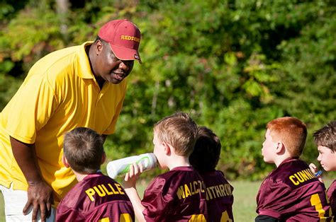 Royalty-Free photo: Man coaching boys during daytime | PickPik