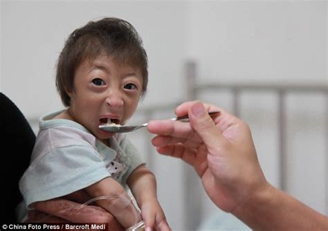 Meet Liang Xiaoxiao... the world's tiniest girl who stands at just 54 ...