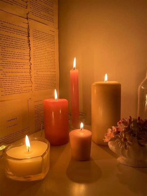 three lit candles sitting on top of a table