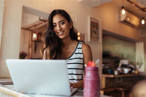 Woman working on laptop computer stock photo (146611) - YouWorkForThem