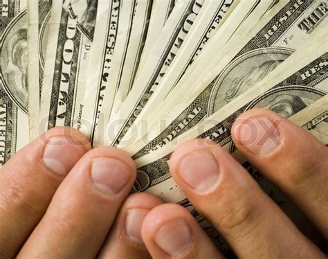 Close up of hands holding money dollars | Stock image | Colourbox