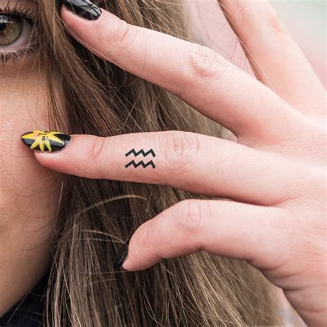 Zodiac Sign Tattoo on Finger: Add a Little Cosmic Flair to Your Look!