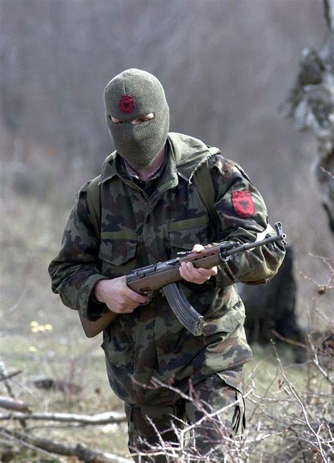 A member of the Kosovo Liberation Army (KLA) armed with a variant of ...