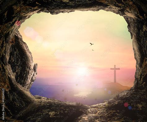 Resurrection of Easter Sunday concept: The cross and empty tomb stone ...