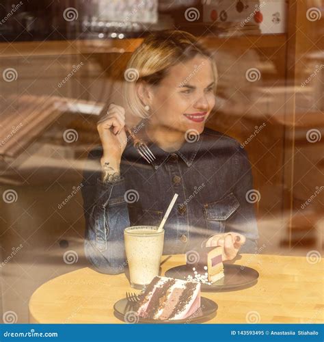 Two Happy Women Sitting in a Cafe, Drink a Cocktail, Tell Each Other ...