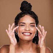 Black woman, face and smile for skincare, makeup or cosmetics against a brown studio background ...