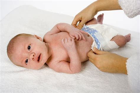 Changing the baby s nappy stock image. Image of infant - 1664499