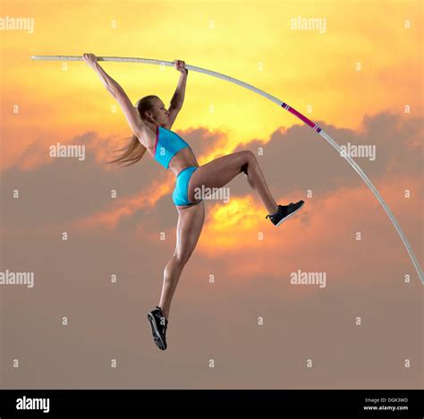 Female athlete doing pole vault Stock Photo - Alamy