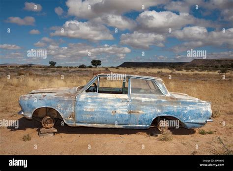 Old car on blocks in the desert, Namibia Stock Photo - Alamy