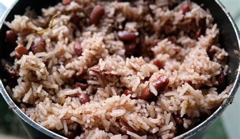 Delicious Authentic Jamaican Rice and Peas Recipe made with coconut milk, allspice, scallions ...