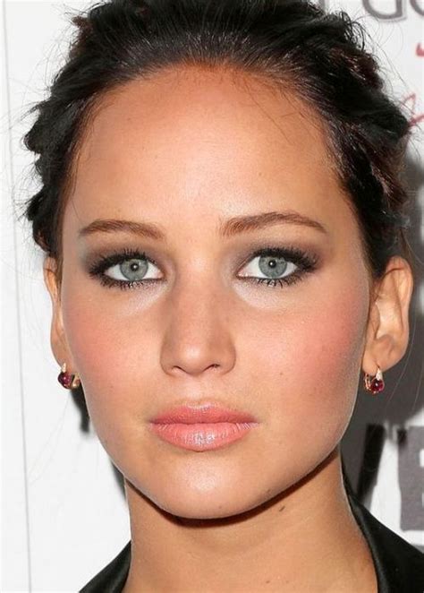 American actress Jennifer Lawrence looks divine with her barely-there dove grey eye shadow and ...