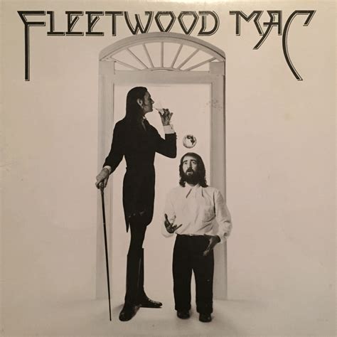 a man standing next to a woman in front of an open door with the words fleetwood mac on it