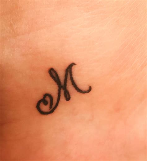 Elegant Wrist Tattoos with Letter M