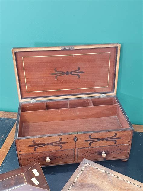An antique mahogany Work Box with two fitted drawers with satinwood stringing decoration, a pair of