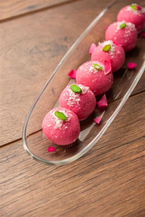 Premium Photo | Delicious Pink Chumchum or rose flavour cham cham or Rasgulla or Rasagola ...