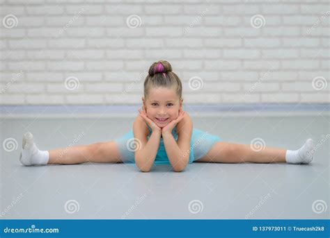 Cute Little Beautiful Girl Doing Splits at Ballet Class. Young Happy Ballerina in Blue Dress ...