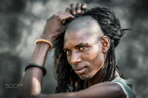 Sudusukai tribesman of the Wodaabe - A Wodaabe tribesman commencing his preparation for the ...