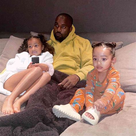 Kanye West Cuddles with Daughters Chicago and North for TV Time