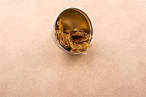 Fake gold coins in a metal plate 16207922 Stock Photo at Vecteezy