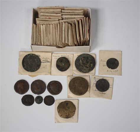 A collection of Roman Empire coins, all with envelopes detailed in ink with identification and locat