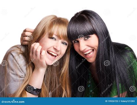 Two smiling girl-friends stock image. Image of hugging - 19926725