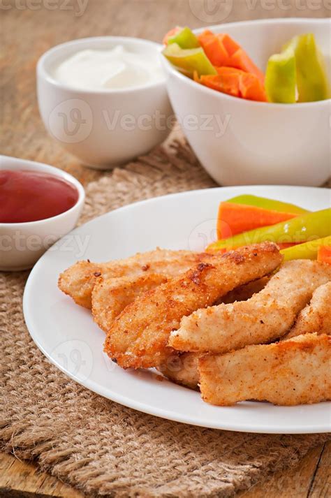 Chicken nuggets with sauce and vegetables 7253816 Stock Photo at Vecteezy