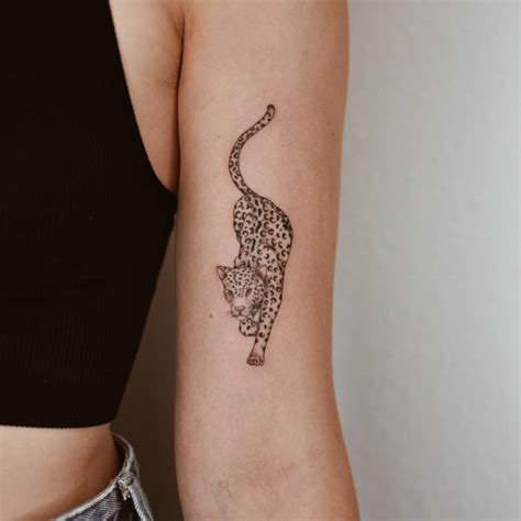 Micro-realistic style leopard tattoo done on the bicep.