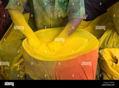 Worker in Dharavi recycling color dyes for use in industries at Dharavi ; Bombay Mumbai ...
