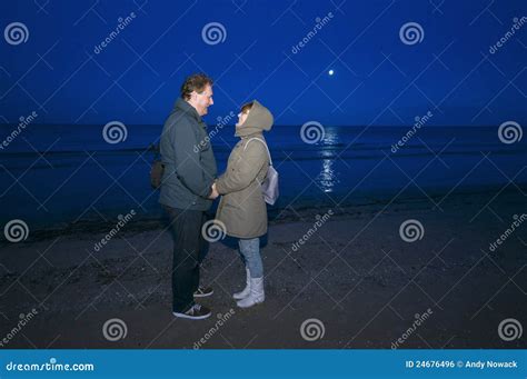 Couple On Beach At Night Royalty Free Stock Image - Image: 24676496