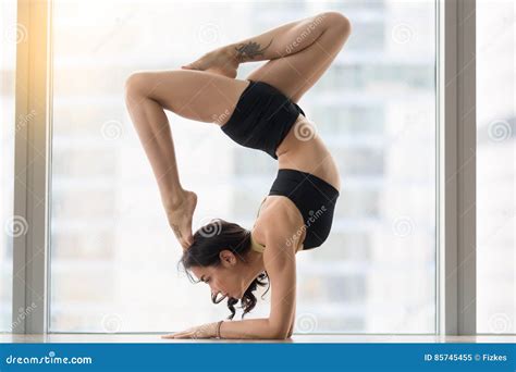 Young Attractive Woman in Pincha Mayurasana Pose Near Floor Wind Stock ...