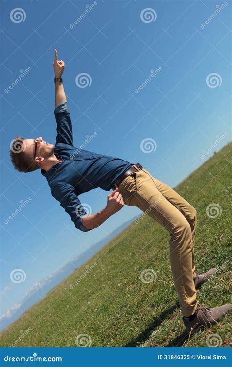 Casual Man Points at the Sky Stock Image - Image of male, latin: 31846335