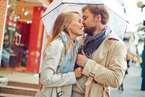 Kissing in the rain stock image. Image of people, love - 21072385