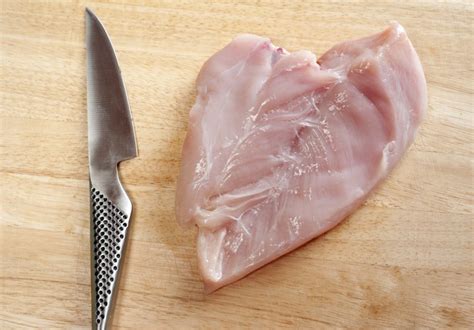 Raw chicken breast cut in a butterfly - Free Stock Image