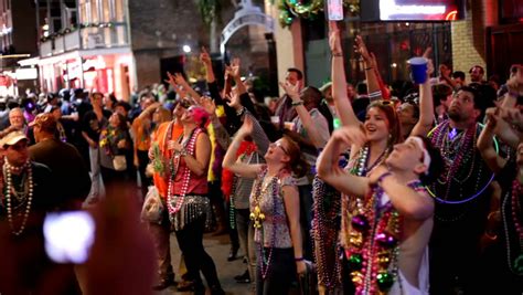 NEW ORLEANS - FEBRUARY 18: Bourbon Street Crowd Handheld Shot During Mardi Gras Celebration On ...