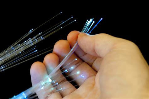 Free Stock image of Bundle of optical fibers held in hand | ScienceStockPhotos.com