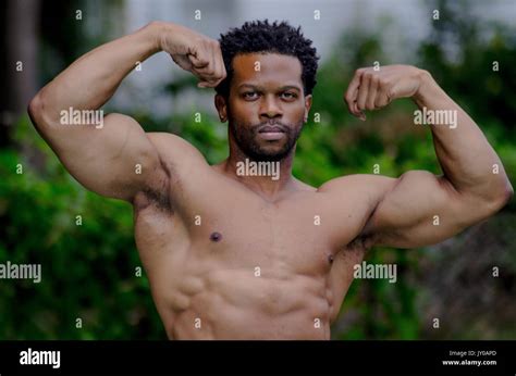 male physique model bodybuilder in pool Stock Photo - Alamy