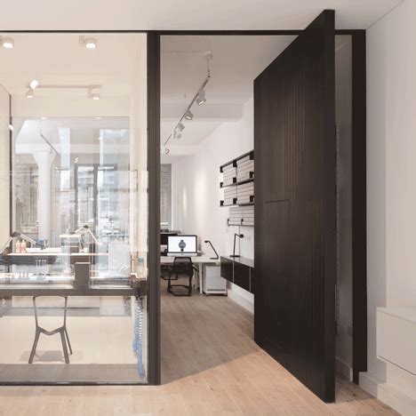 Uniform Wares offices include a glazed watch-testing room and a pivoting timber door | Office ...