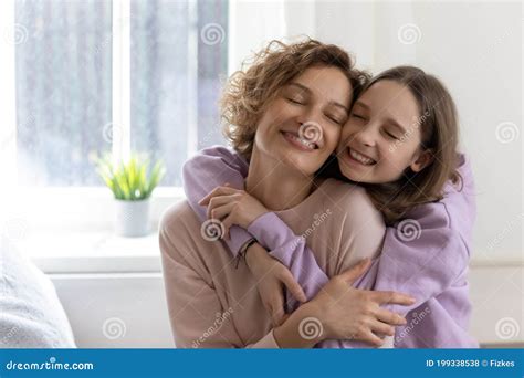 Happy Teenage Daughter Hug Mom Showing Love and Care Stock Photo ...