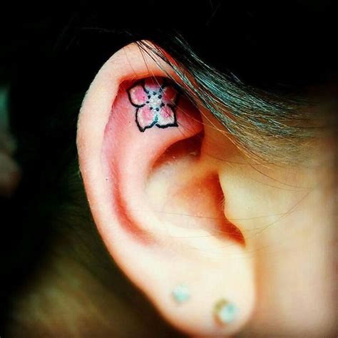 7 Floral Ear Tattoos That Are Beyond Adorable | Brit + Co | Ear tattoo, Tattoos, Behind ear tattoo