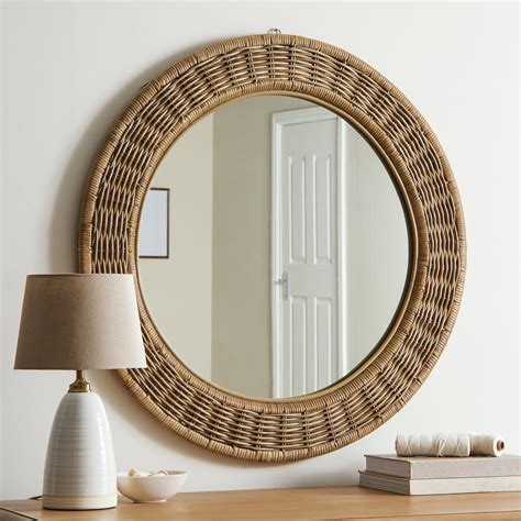 Perfect for adding a rustic feel to your home, this handmade wicker mirror is stylish and on ...