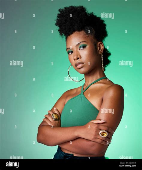 Green screen, face makeup and black woman with power against a green mockup studio background ...