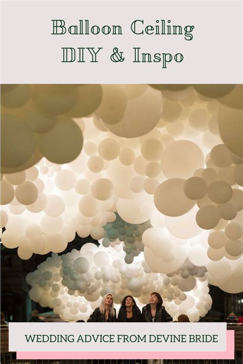 three women are standing in front of white balloons