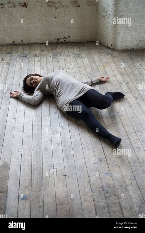 Dead woman's body on the floor Stock Photo - Alamy