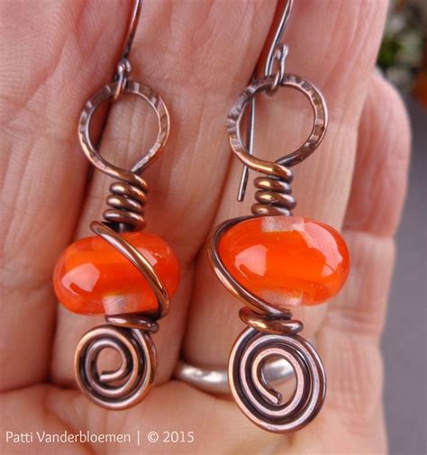 Orange and Copper Swirl Earrings | Copper wire jewelry, Handcrafted earrings, Swirl earrings