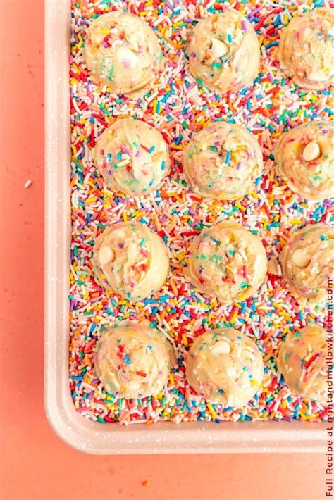 sprinkle covered cookies in a plastic container