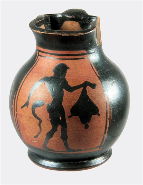 A pottery black figure chous decorated with the silhouette of a striding satyr holding a wine ...